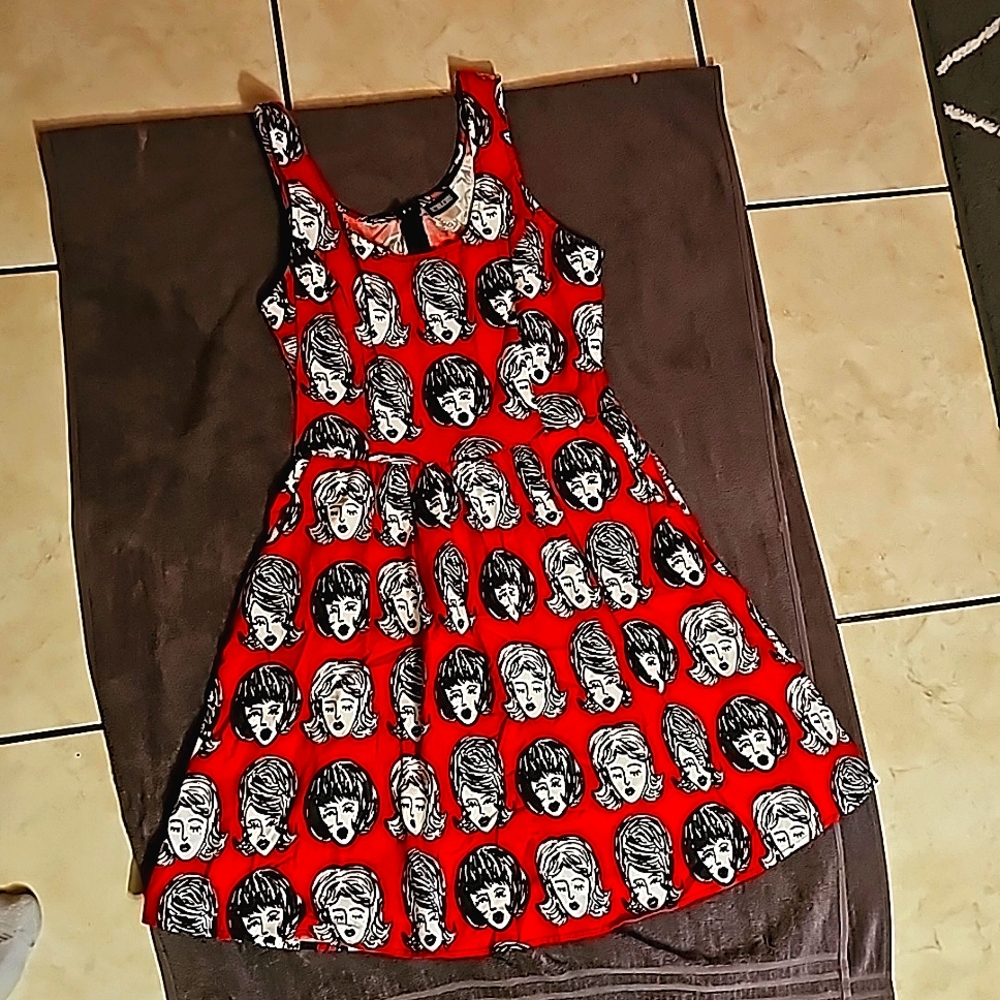 Retrolicious red dress with bouffant haired women pattern. Size large